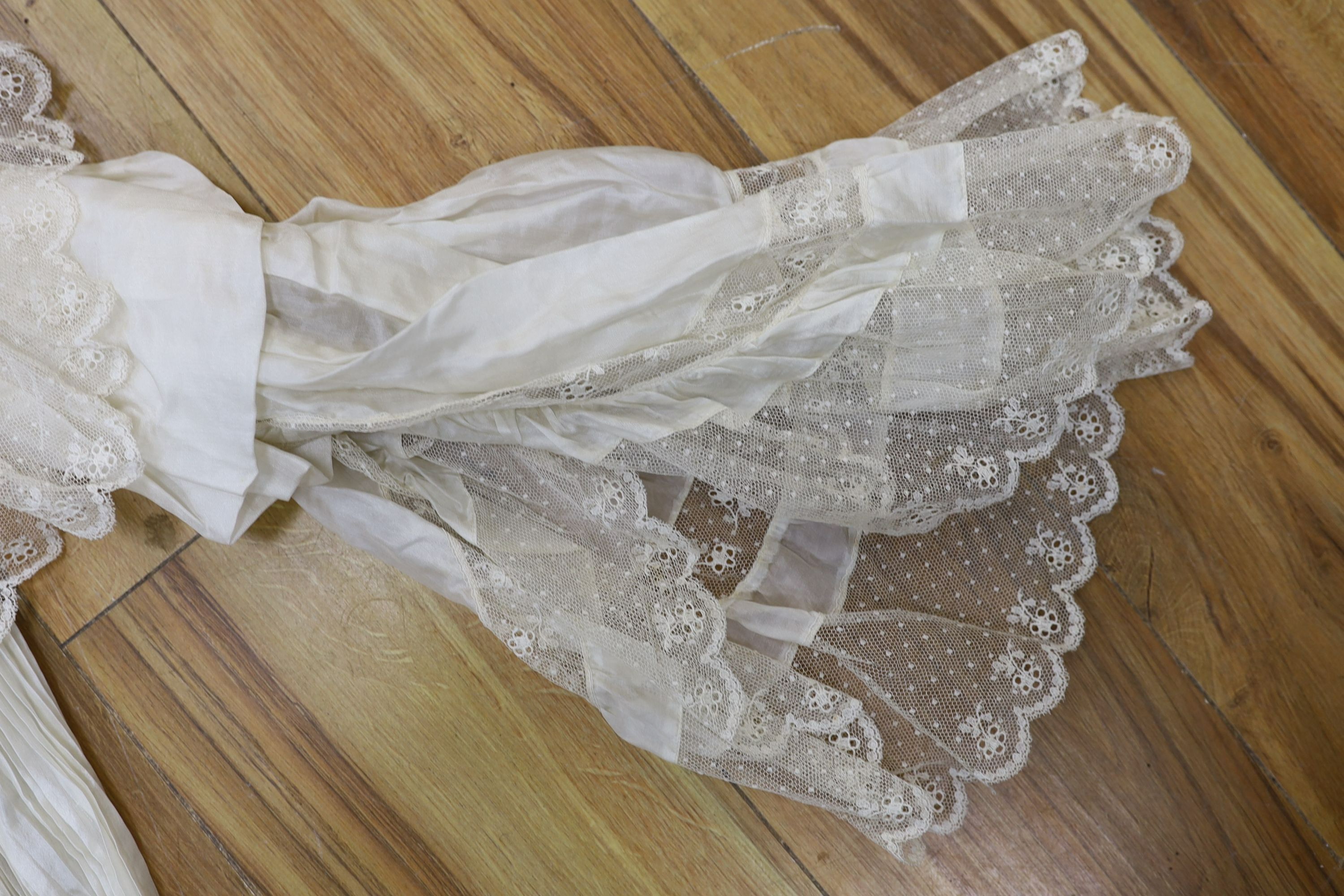 A fine cream silk and lace inserted pleated jacket